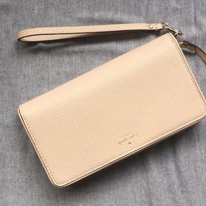Kate Spade wristlet. Beige with black trim.